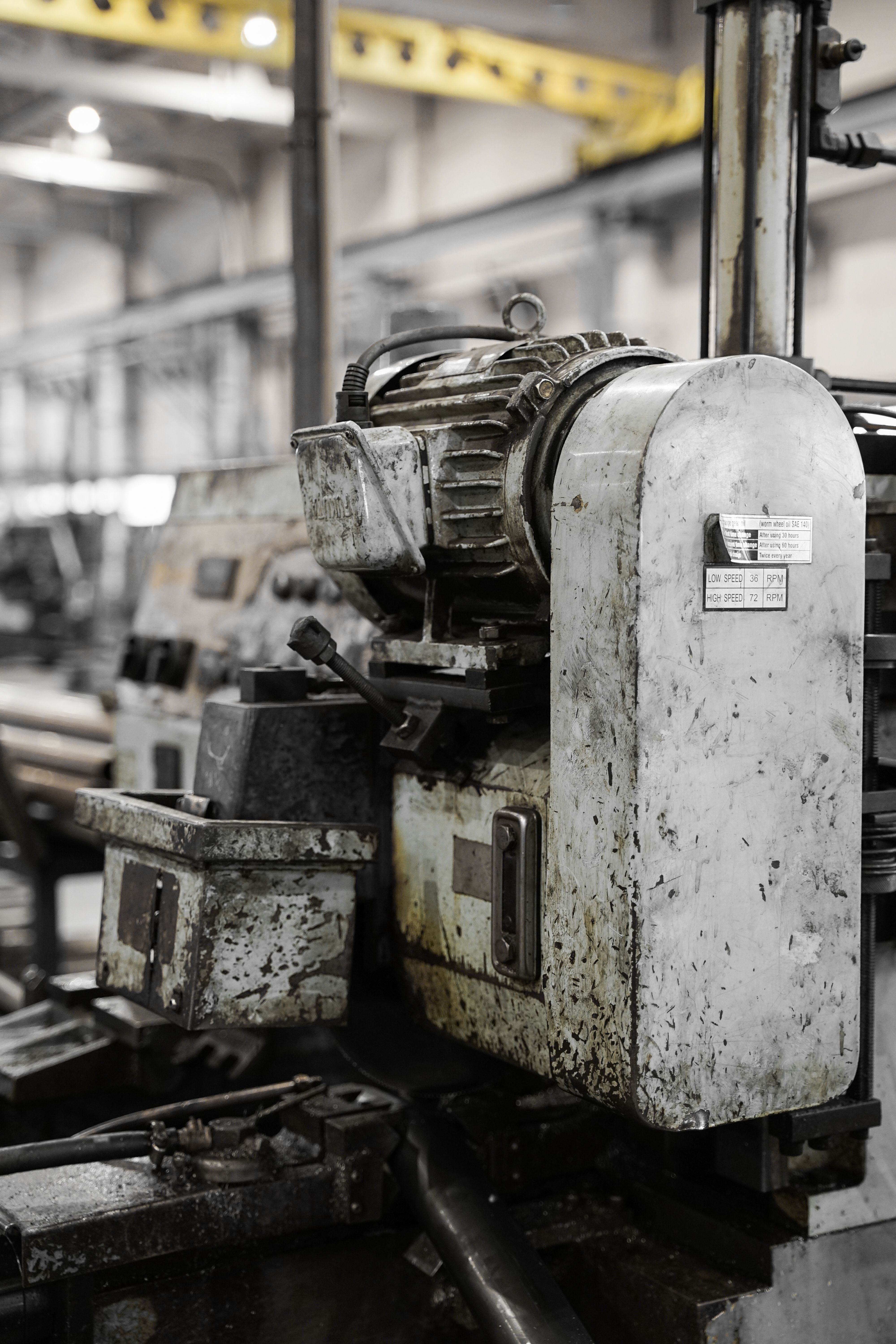 Greasy industrial machinery and metal components in a factory